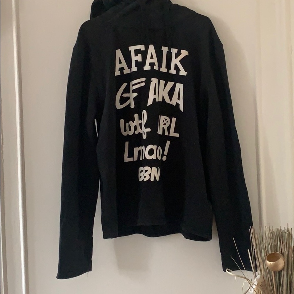 Black hoodie with bold writing